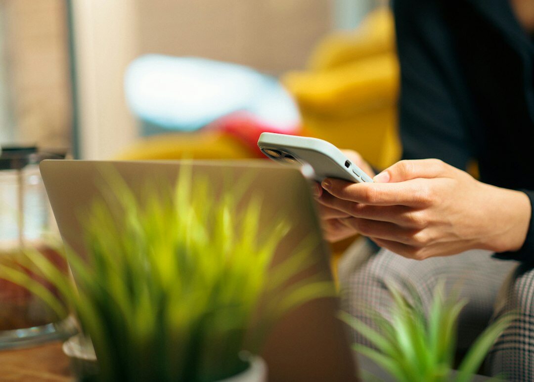 person using smartphone at home